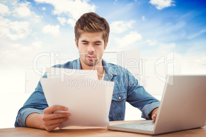 Composite image of hipster looking at documents while sitting at