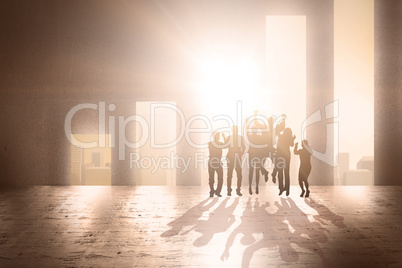 Composite image of silhouetters celebrating