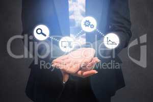 Composite image of businesswoman with hands out
