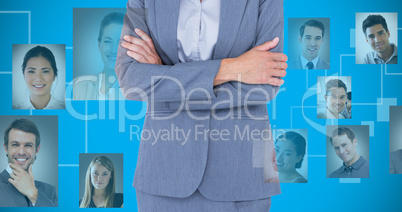 Composite image of portrait of smiling businesswoman standing ar