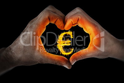 Composite image of couple making heart shape with hands