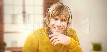 Composite image of smiling hipster businessman using headset