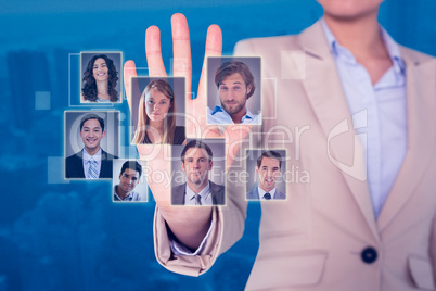 Composite image of businesswoman touching