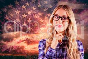 Composite image of gorgeous smiling blonde hipster thinking