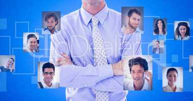 Composite image of portrait of smiling businessman standing arms