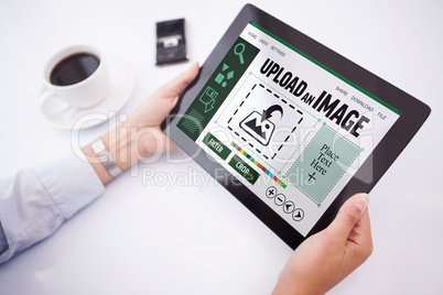 Composite image of man using tablet pc