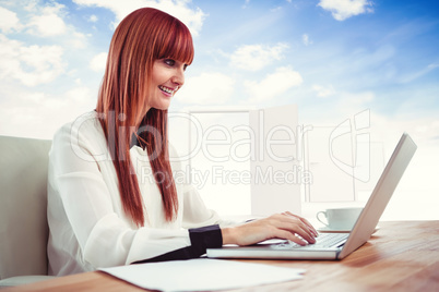 Composite image of smiling hipster businesswoman using her lapto