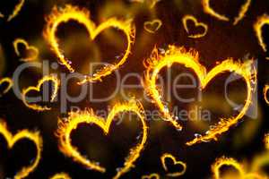 Composite image of heart shapes on fire