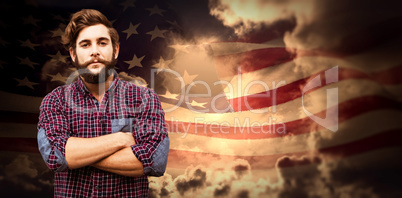 Composite image of confident hipster with arms crossed