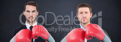 Composite image of businessman with boxing gloves