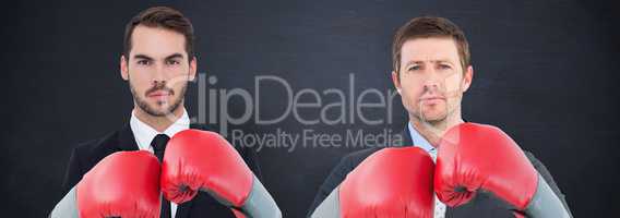 Composite image of businessman with boxing gloves