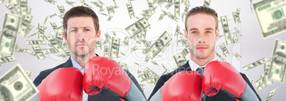 Composite image of businessman with boxing gloves