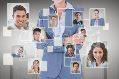 Composite image of portrait of smiling businesswoman standing ar