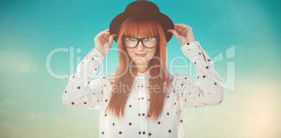 Composite image of attractive smiling hipster woman with hat