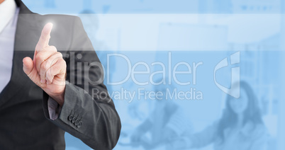 Composite image of businessman pointing his finger at camera