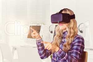 Composite image of pretty casual worker using oculus rift