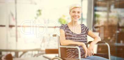 Composite image of smiling woman in a wheelchair