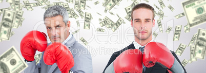 Composite image of businessman with boxing gloves