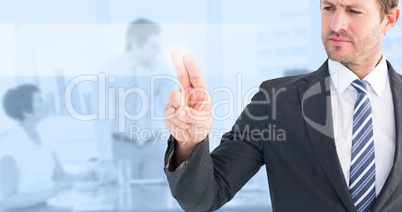 Composite image of businessman pointing with his finger