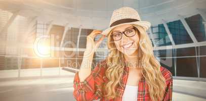 Composite image of gorgeous smiling blonde hipster posing