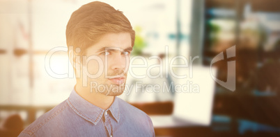 Composite image of portrait of serious hipster