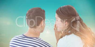 Composite image of woman whispering secret to boyfriend
