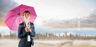 Composite image of businesswoman with umbrella