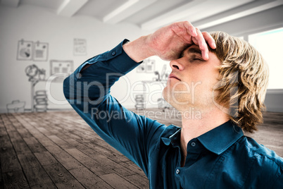 Composite image of troubled hipster businessman holding his head
