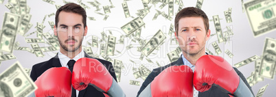 Composite image of businessman with boxing gloves