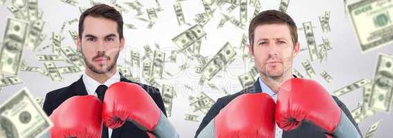 Composite image of businessman with boxing gloves