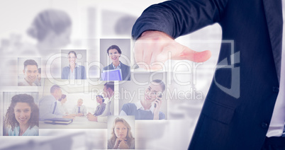 Composite image of businessman pointing with his finger