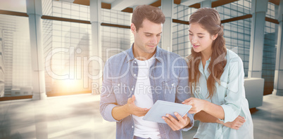 Composite image of business people with tablet