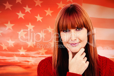 Composite image of thoughtful hipster woman looking at camera