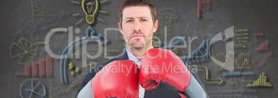 Composite image of businessman with boxing gloves