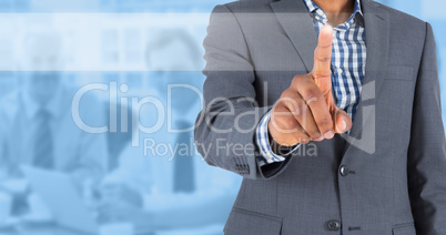 Composite image of focused businessman pointing