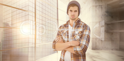 Composite image of portrait of confident hipster with arms cross Composite image of portrait of confident hipster with arms cross