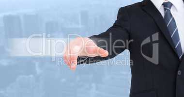 Composite image of businessman in suit pointing his finger