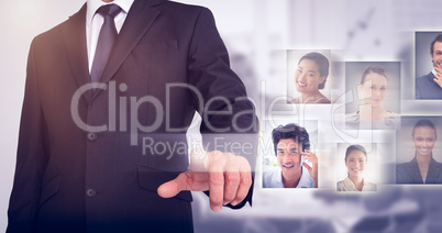 Composite image of businessman pointing