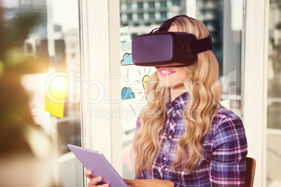 Composite image of pretty casual worker using oculus rift