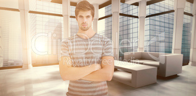 Composite image of portrait of confident businessman with arms c