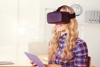 Composite image of pretty casual worker using oculus rift