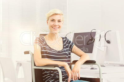 Composite image of smiling woman in a wheelchair