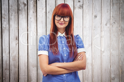 Composite image of attractive hipster woman with crossed arms