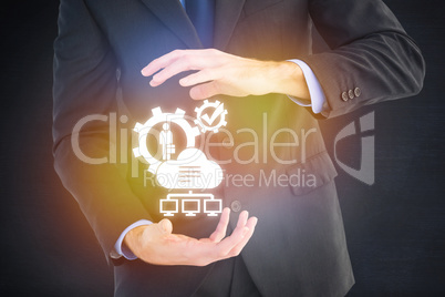 Composite image of mid section of a businessman presenting with