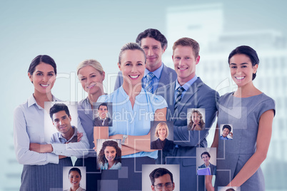 Composite image of business team smiling at camera