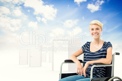 Composite image of smiling woman in a wheelchair