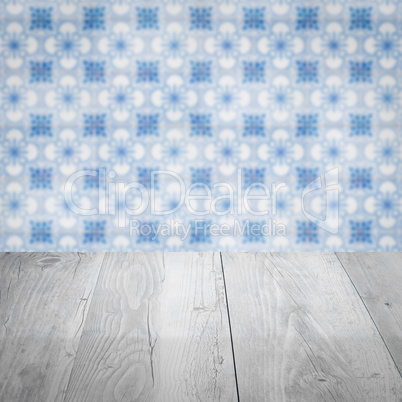 Wood table top and blur vintage ceramic tile pattern wall Wood table top and blur vintage ceramic tile pattern wall