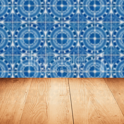 Wood table top and blur vintage ceramic tile pattern wall