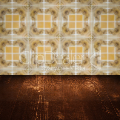 Wood table top and blur vintage ceramic tile pattern wall