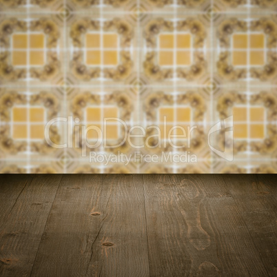 Wood table top and blur vintage ceramic tile pattern wall